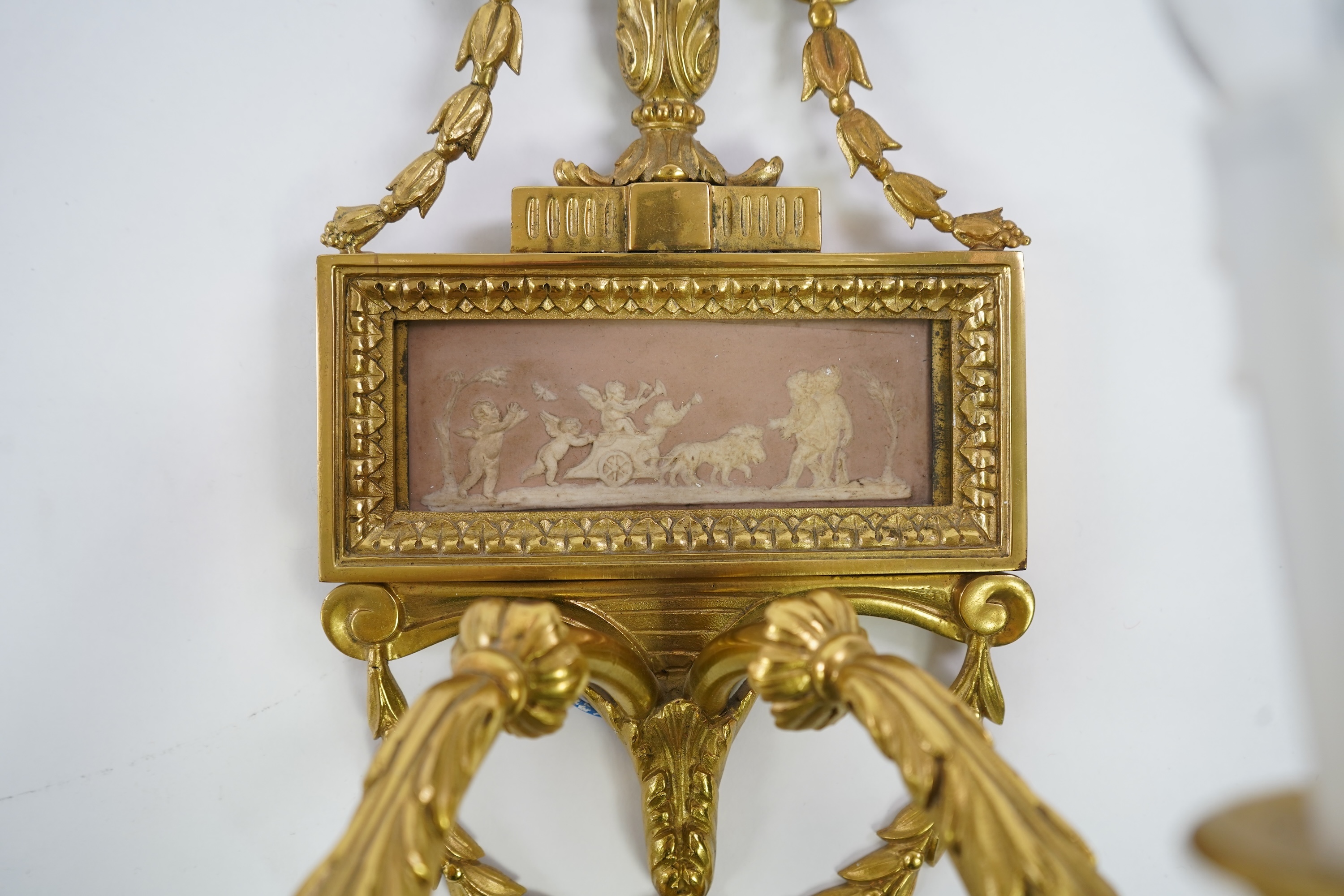 A set of four Adam style ormolu and jasper ware mounted wall appliques, early 20th century